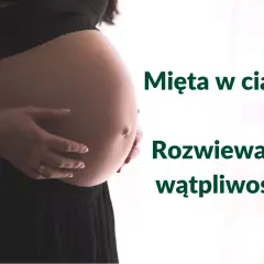 Brzuch kobiety w ciąży, z dłońmi delikatnie go obejmującymi. Obok tekst: "Mięta w ciąży? Rozwiewamy wątpliwości!".