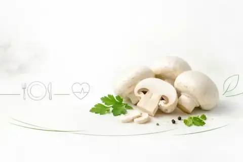 Świeże pieczarki z natką pietruszki i ikoną serca. Czy pieczarki są zdrowe? Tak, to pyszny i wartościowy dodatek do diety.